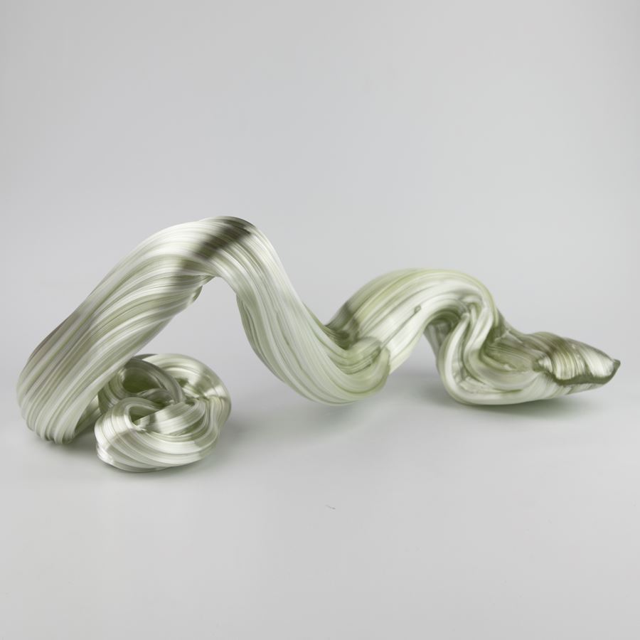 glossy light green organic ridged twisting candy like sculpture handmade from glass