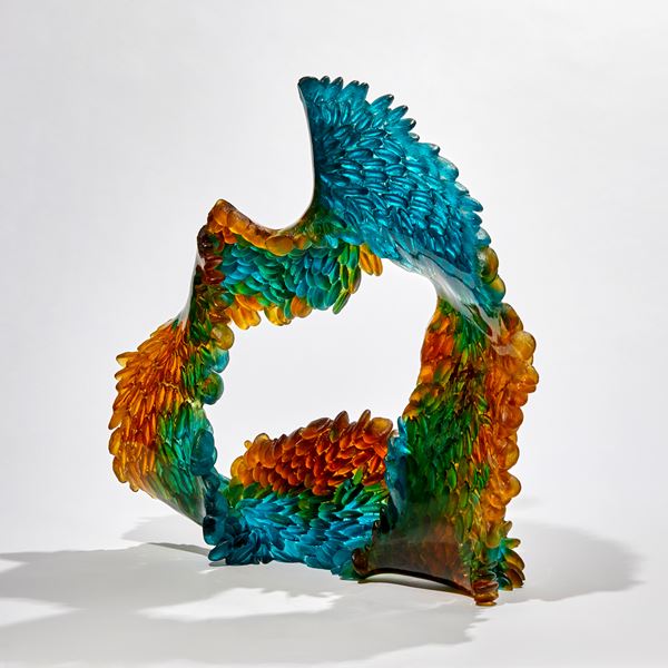 green turquoise and amber continuous ringed scaled sculpture made from glass
