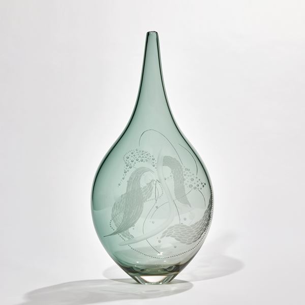 soft jade green see-through teardrop shaped handmade glass bottle with swirling cut surface patterns