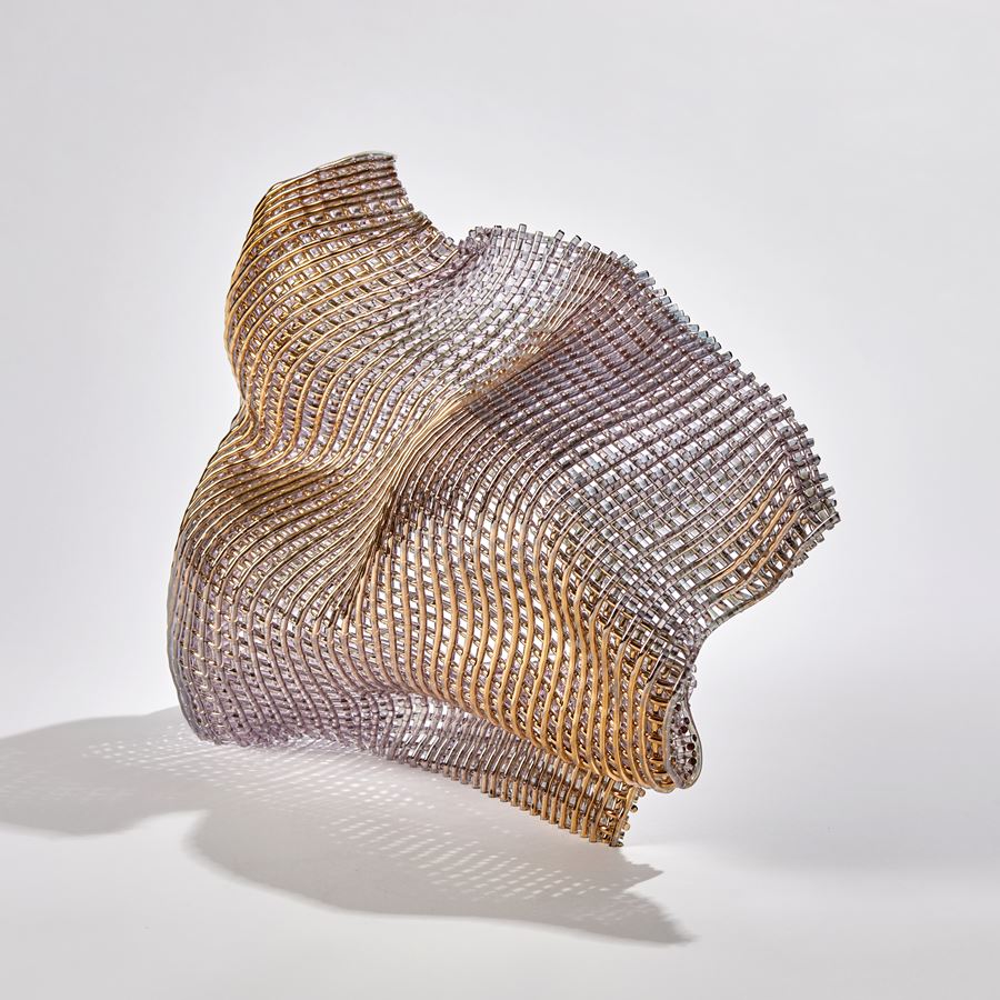 standing woven soft form with gold appearance handmade from canes of glass