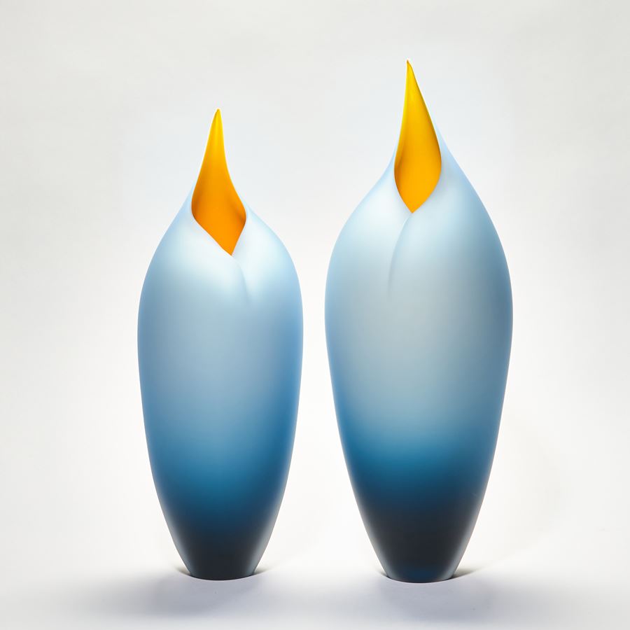 handblown abstract minimalist glass sculpture of blue and orange birds