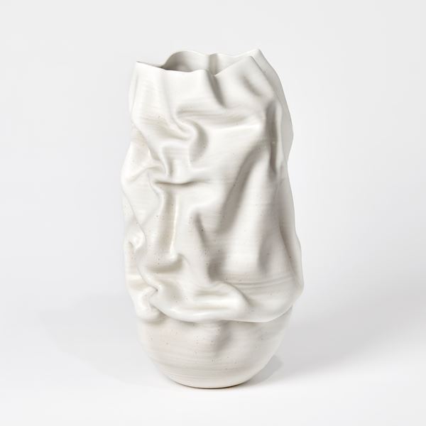 cream crumpled tall vessel with slash handmade from clay