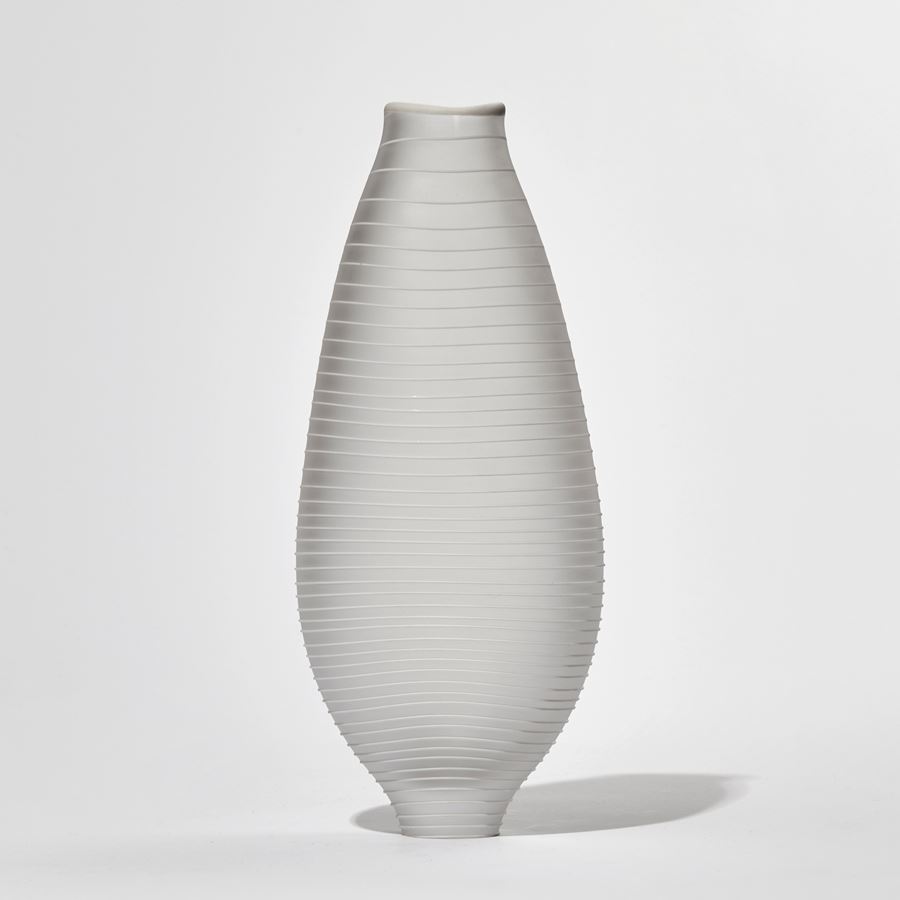matt clear teardrop shaped handmade glass vase with raised white line circling from top to bottom