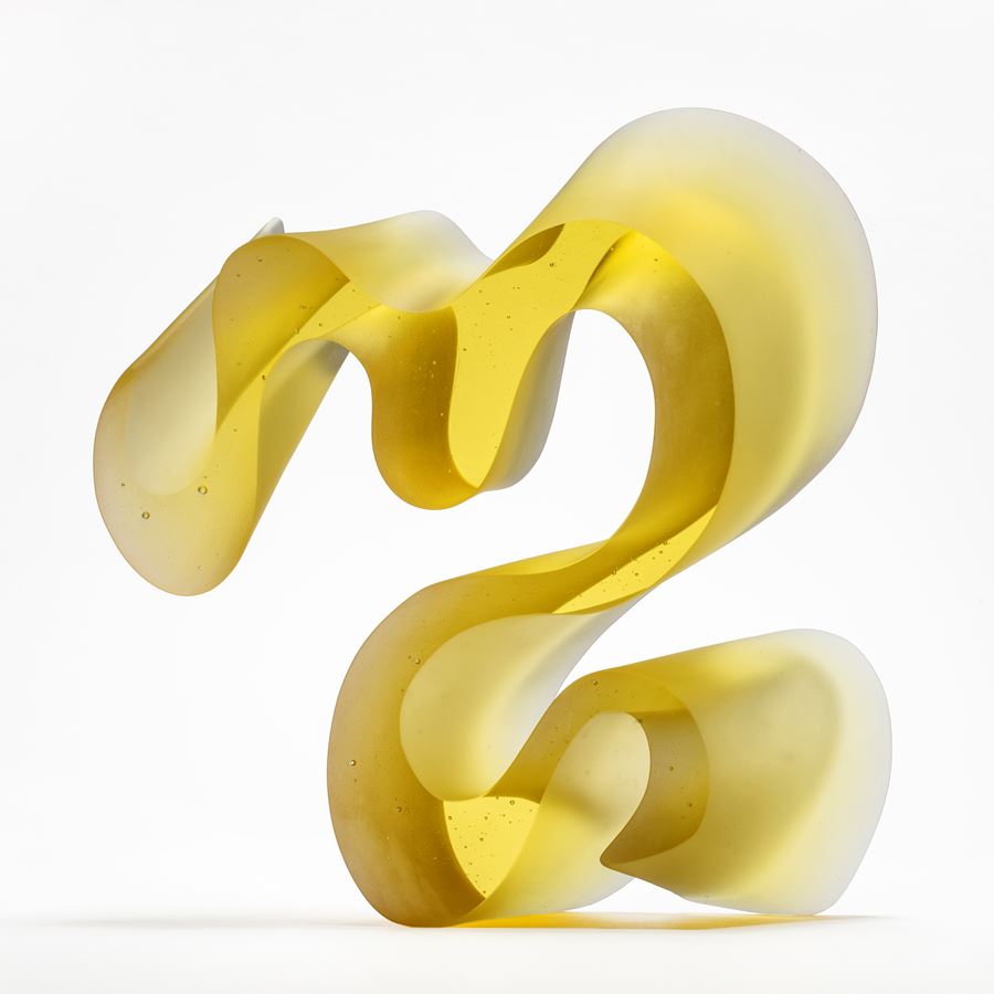 yellow standing curling line sculpture handmade from cast glass