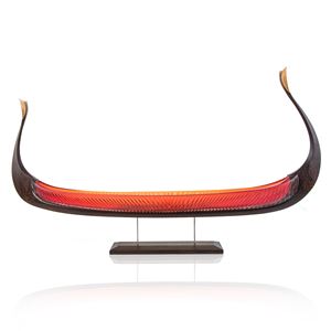 handblown glass and carved wood sculpture of viking ship in red and dark brown