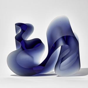 deep midnight blue thick curling abstract line sculpture with flat front and back handmade from cast glass