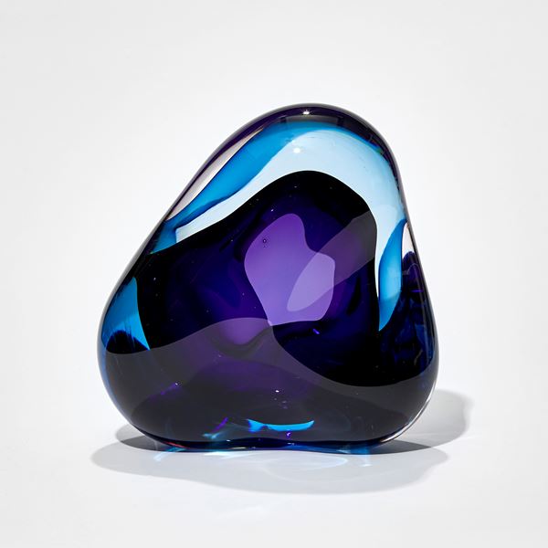 deep turquoise and purple amorphic sculpture hand crafted from glass with central opening