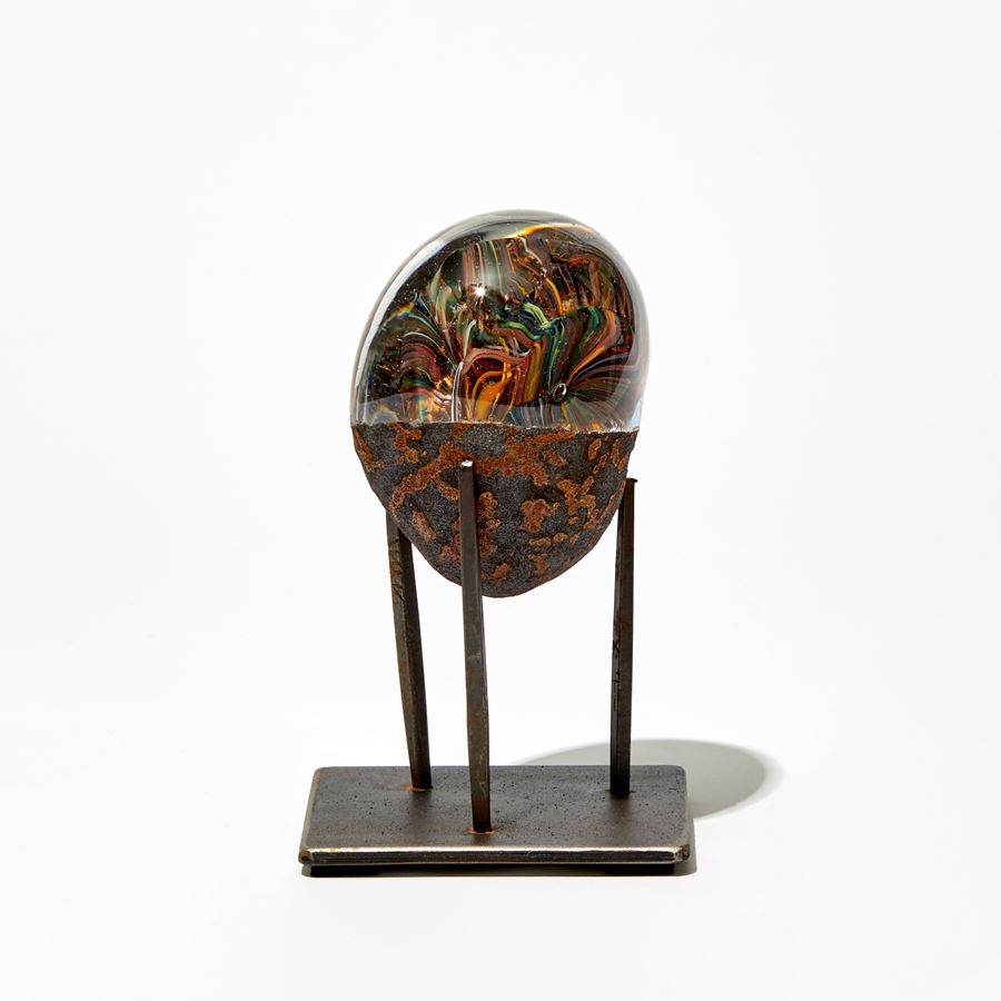 rust and clear egg shaped sculpture handmade from glass and steel