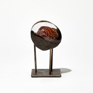 meteor inspired glass and metal sculpture handmade from glass and steel in clear, red and dark brown