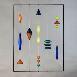 steel frame with suspended coloured handblown and cut geometric shapes in blue amber and jade