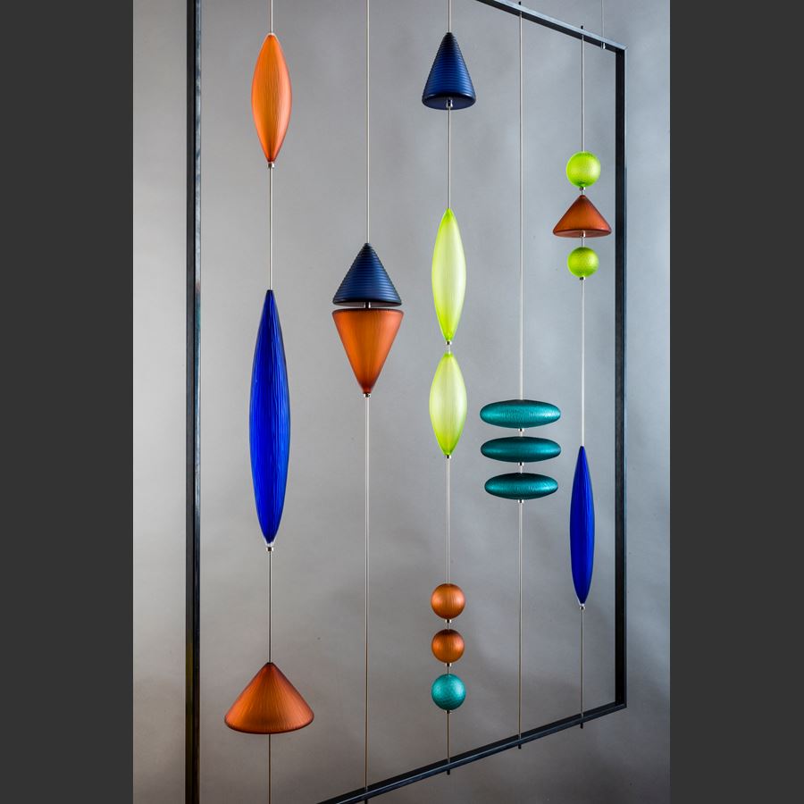 steel frame with suspended coloured handblown and cut geometric shapes in blue amber and jade