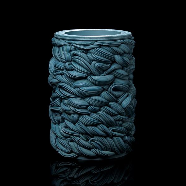 turquoise blue unevenly woven tubular vessel handmade from parian porcelain