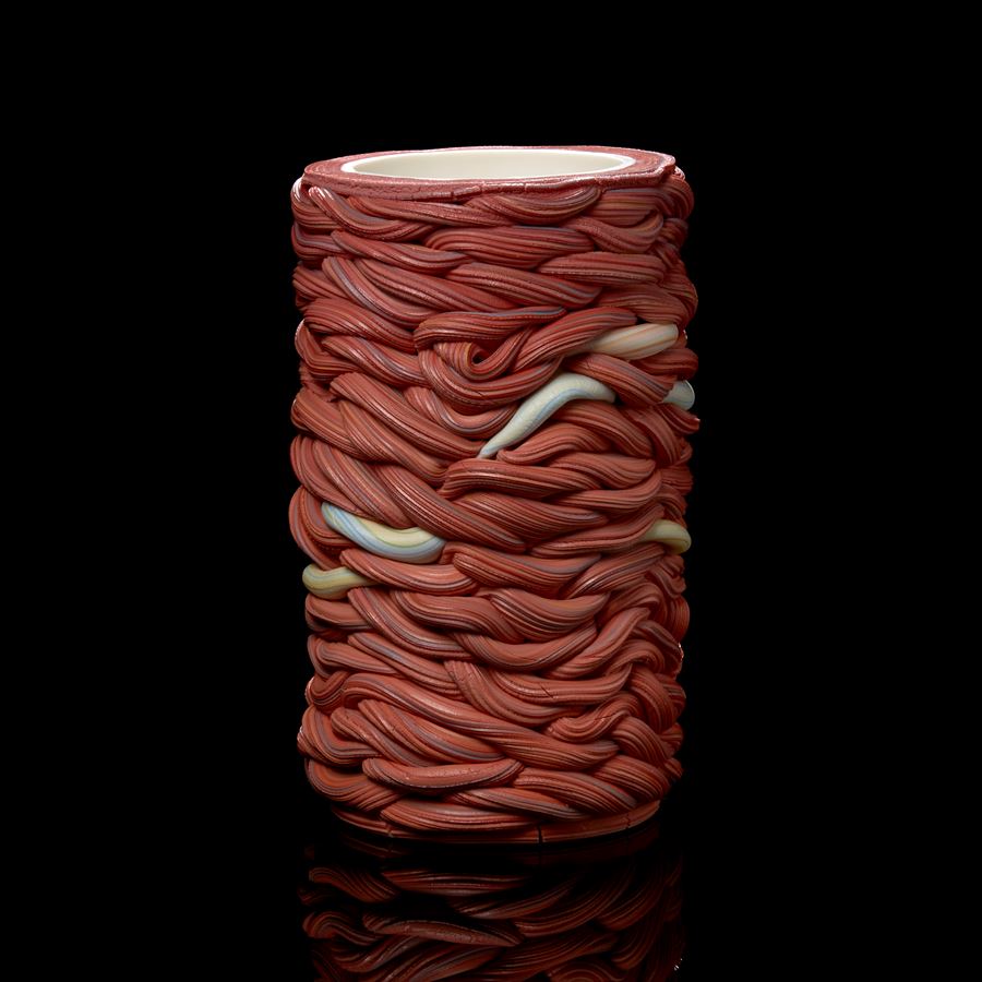 red and mixed colours interwoven cylinder vessel handmade from parian porcelain