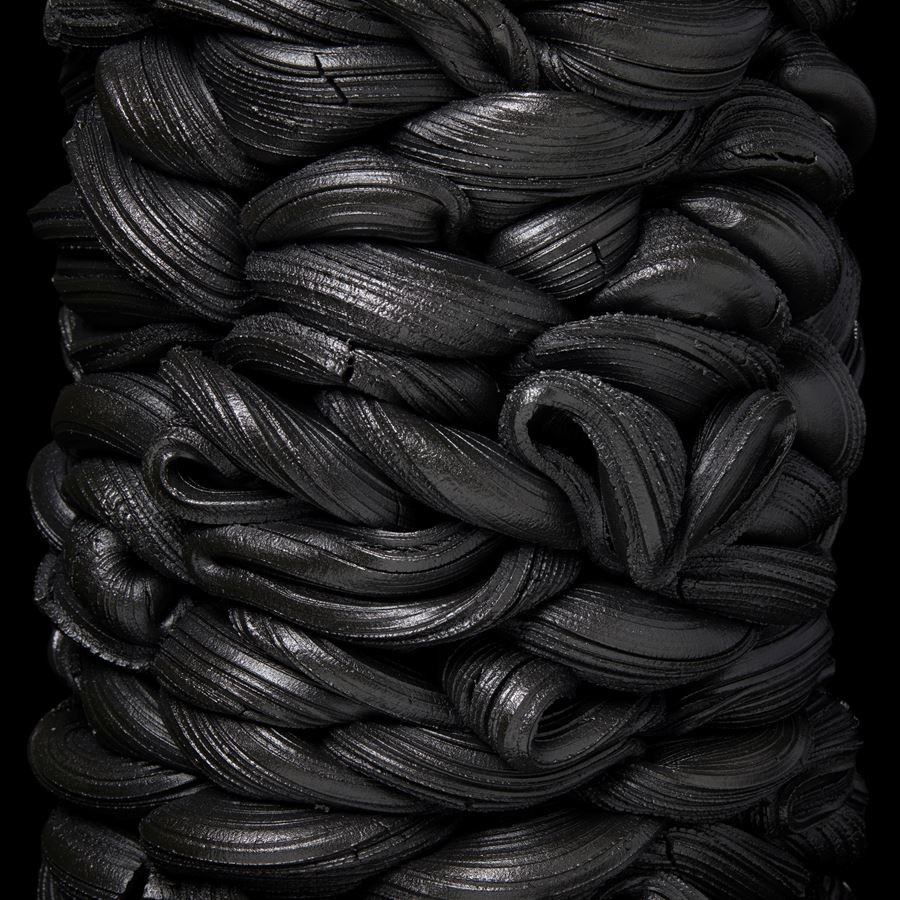 black liquorice stacked interwoven vessel handmade from clay 