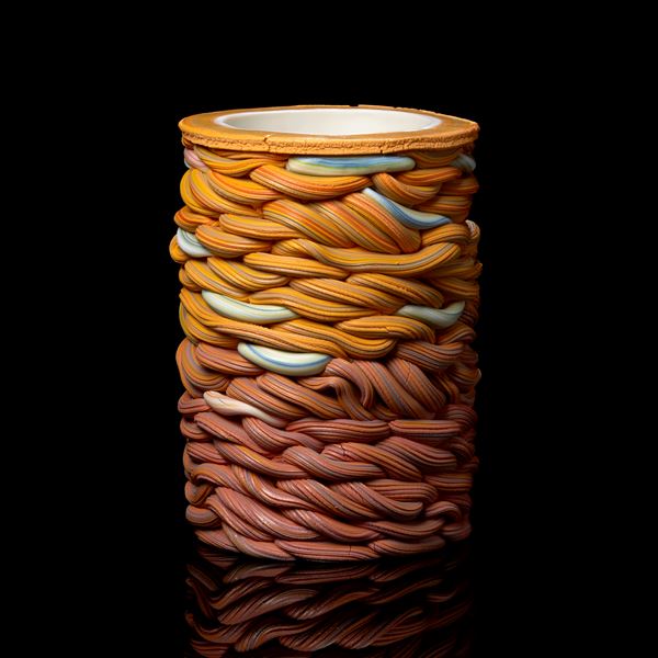 graduating from salmon pink to yellow with blue sections towering woven handmade ceramic vessel