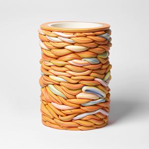 interwoven sticks of rock created a stacked circular vessel handmade from parian porcelain
