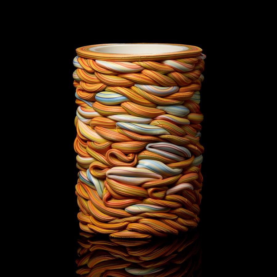 interwoven sticks of rock created a stacked circular vessel handmade from parian porcelain