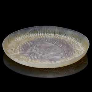 autumnal colours low round platter with enlarged feather texture and detail handmade from glass