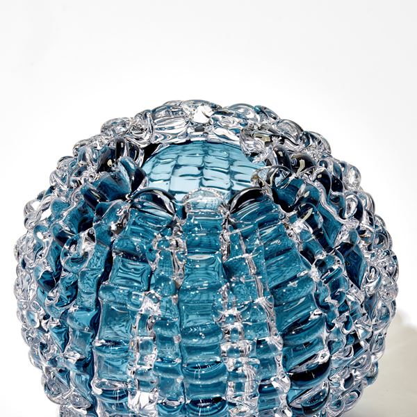 aqua blue echinus inspired round hand blown glass vase with rippled surface