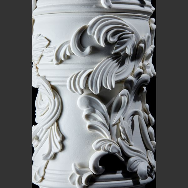 white undulating column with organic flourishes and relief swirl details handmade and thrown from porcelain