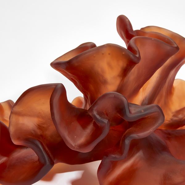burnt orange amber organic seaweed like sculpture hand made from cast glass