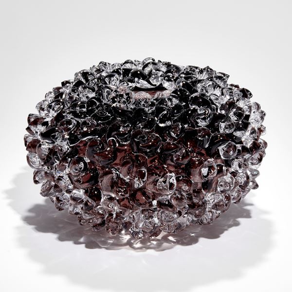 low round soft blob covered vessel hand blown from aubergine brown coloured glass