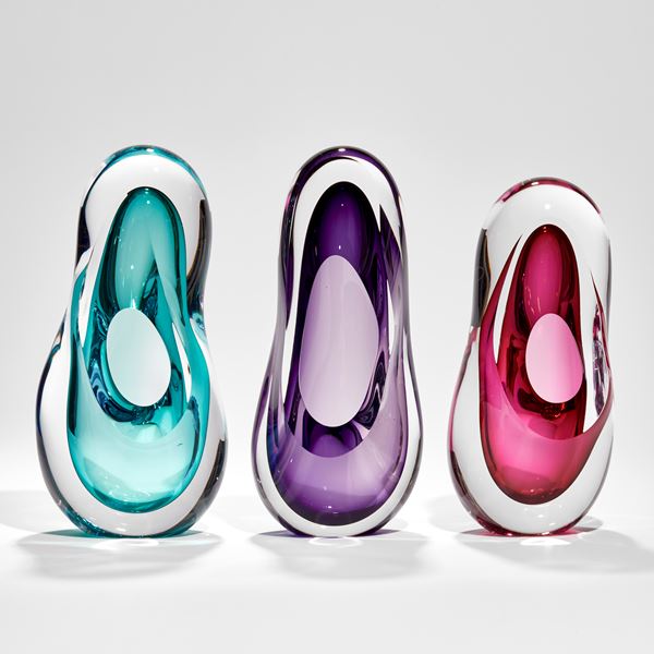 tall soft and rounded amorphous shaped sculpture in clear and purple hand made from glass