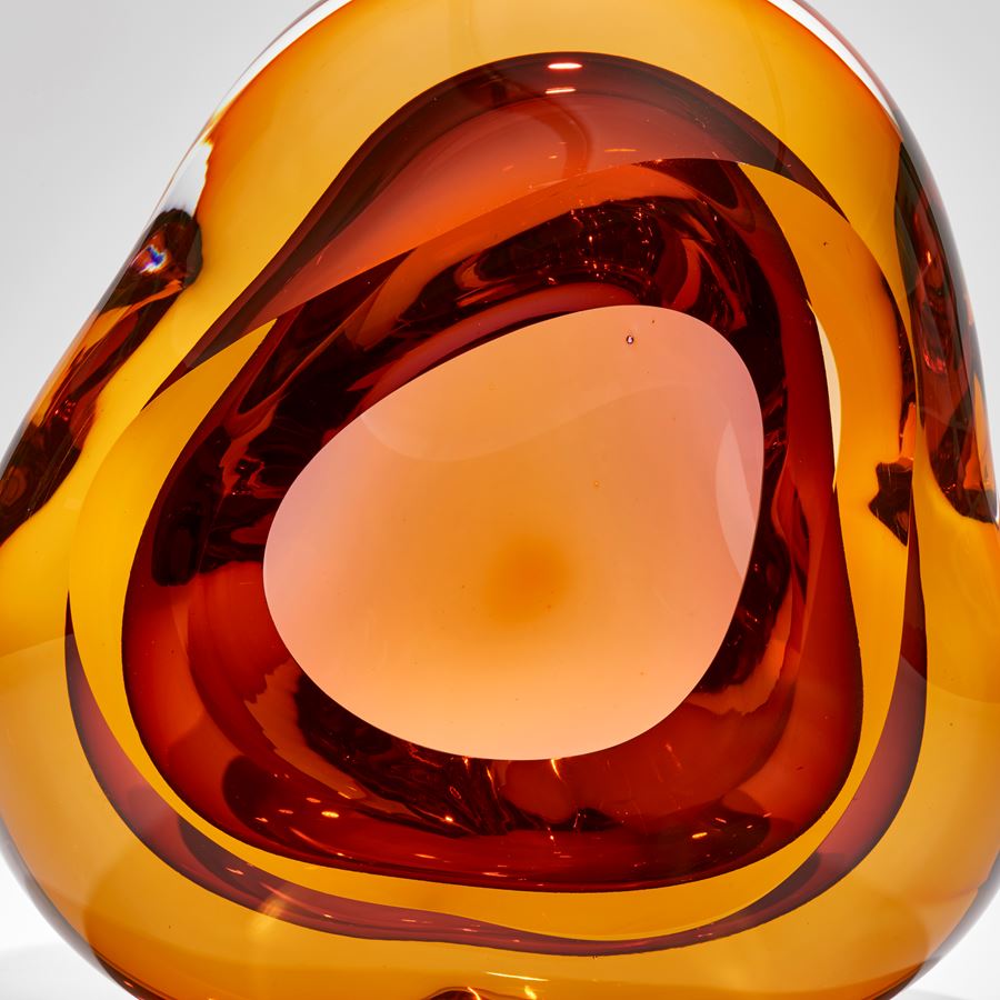 brilliant gold and rich orange red amorphous sculpture with front opening hand made and sculpted from glass