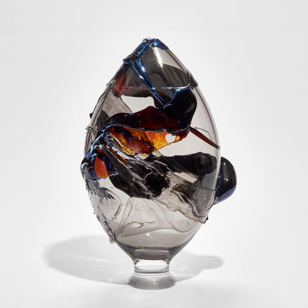teardrop shaped glass vase in clear smoke blue amber glass with organic raised surface decoration