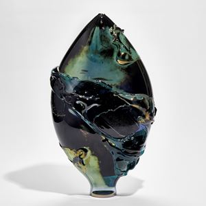 black blue and green lustrous oval vessel with organic smeared texture across the surface handmade from glass