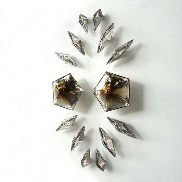 pentagons and diamond wall mounted formation in bronze glass with mirrored interior