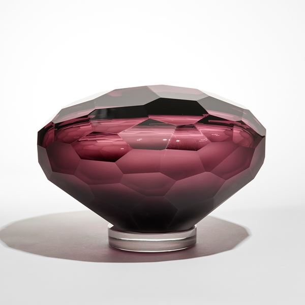 abstract mushroom shaped facetted sculpture in rich red purple hand made from glass