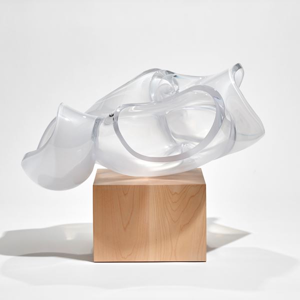 cube of birch wood with balanced abstract human heart aorta sculpture in clear and frosted glass hand made