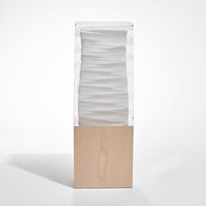 rectangular upright sculpture with birch base and white and clear glass top with inner folded origami detail