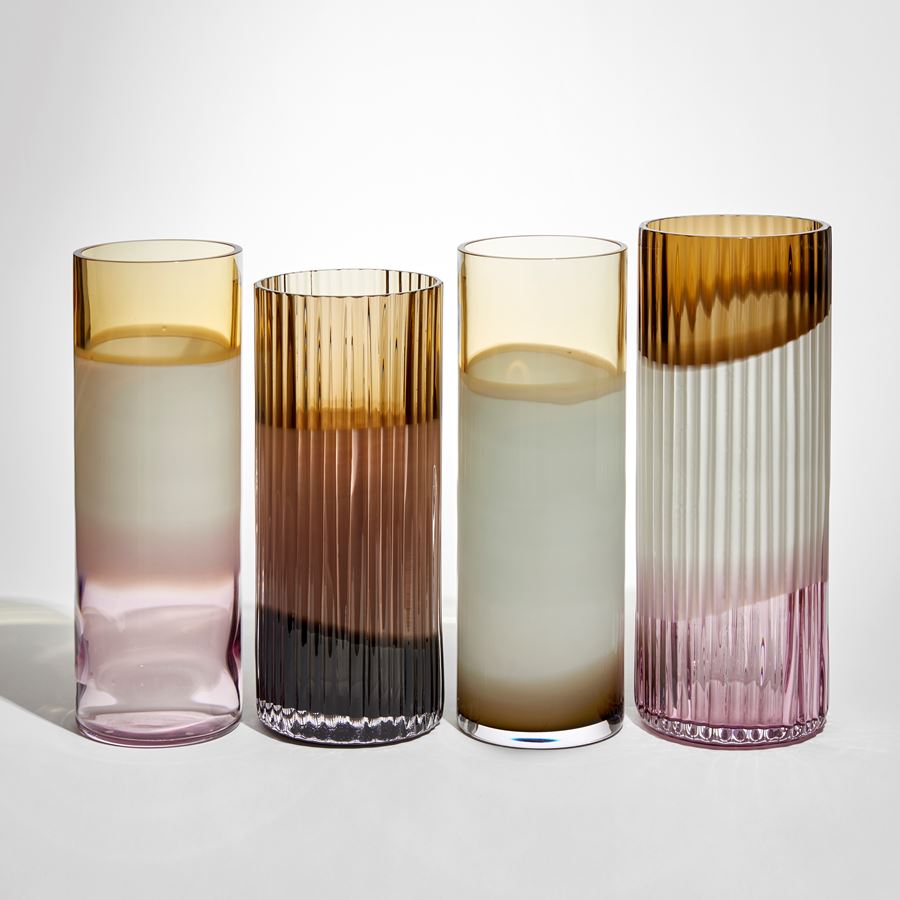 brown opaque white and pink round cylinder vase with external organic ridges hand made from glass 