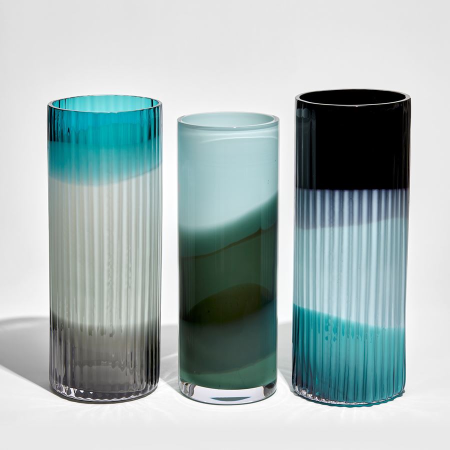 ridged cylinder vase in three bands of turquoise light blue and black hand made from glass