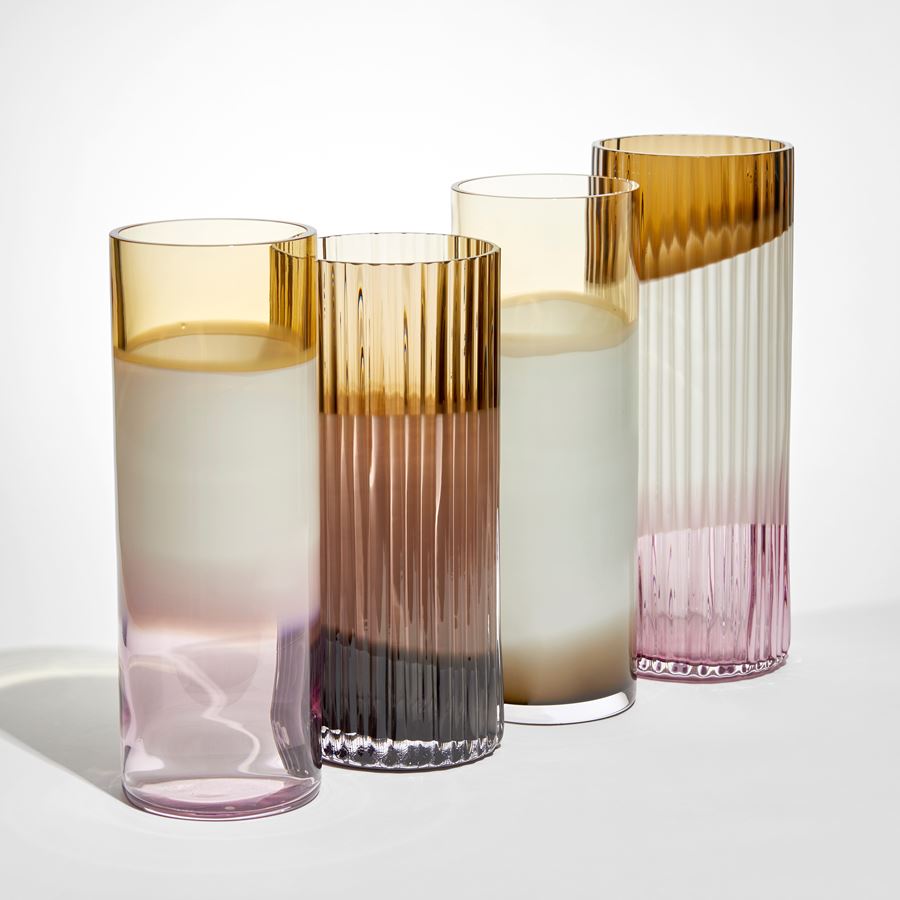 smooth cylindrical vase in abstract uneven bands of transparent amber opaque white and brown hand made from glass