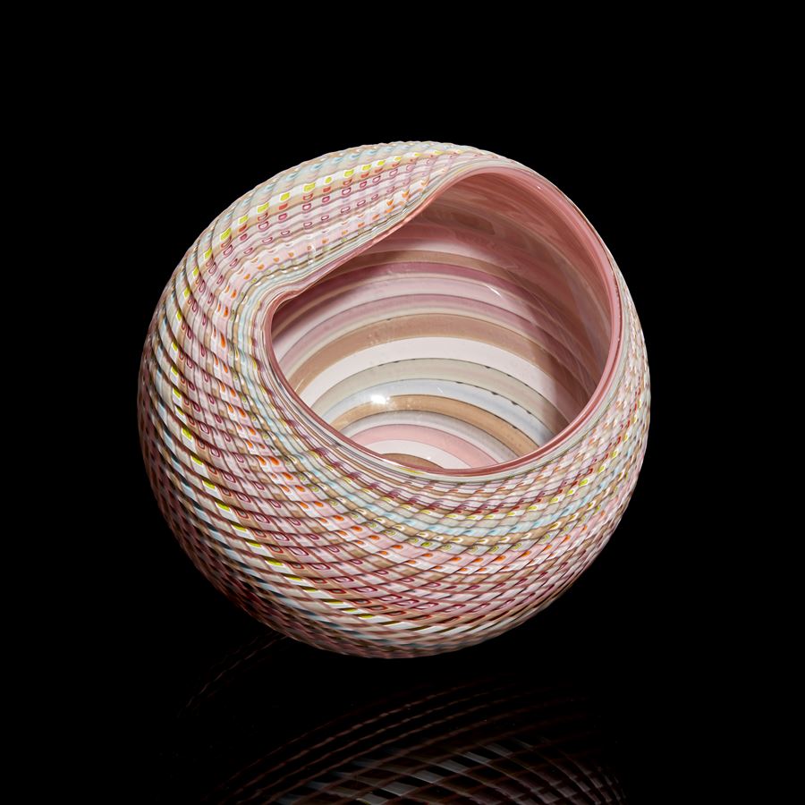 pastel coloured banded and textured abstract rounded shell inspired sculpture with matt exterior and glossy interior hand made from glass