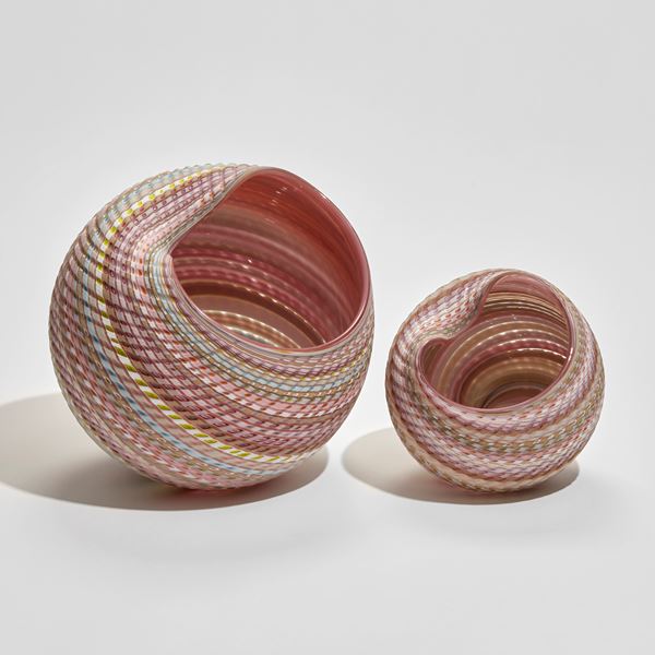 rounded striped shell like sculptural vessel in mixed pastel colours hand made from glass
