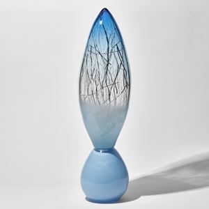 pale baby blue and aquamarine tall glass sculpture with rounded base and pointed oval top with thin white and silver glass canes trapped inside