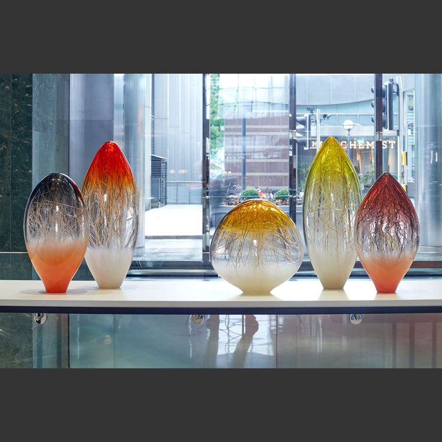 bright orange grey and clear glass standing ovoid sculpture handmade from glass with interior line detail