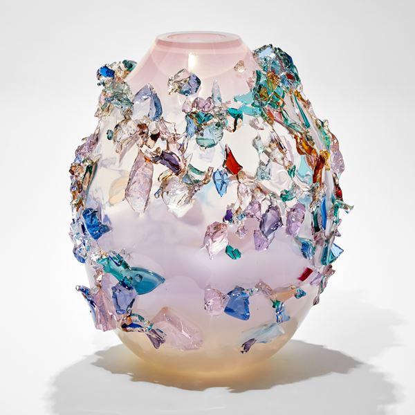 round oval pastel coloured glass vase covered in organic shards of glass in blue pink purple and jade hues