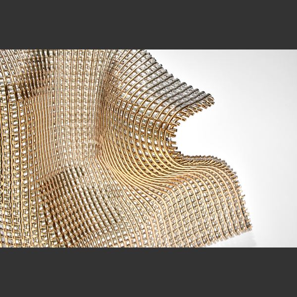 suspended and standing woven cloth of gold made of thick threads hand made from glass 
