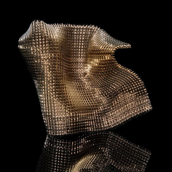 suspended and standing woven cloth of gold made of thick threads hand made from glass 