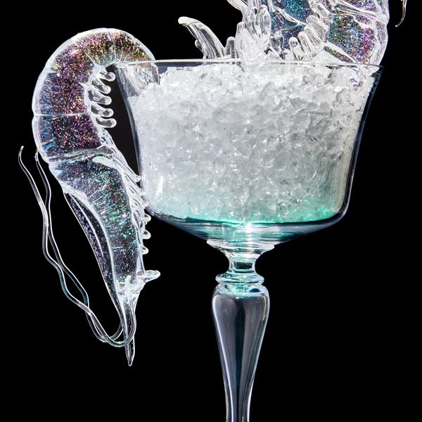 fancy goblet with crushed ice and two prawns with plinth below with prone prawn and sea shell hand made from clear glass