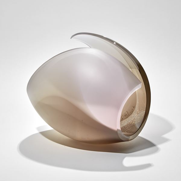 curled shell like form in bronze and pink with a shower of tiny golden dots handmade from glass