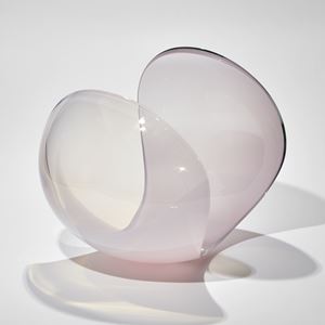 rounded sweeping form with cut away sides in soft milky pink handmade from glass
