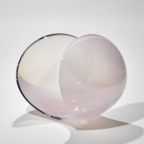 rounded sweeping form with cut away sides in soft milky pink handmade from glass