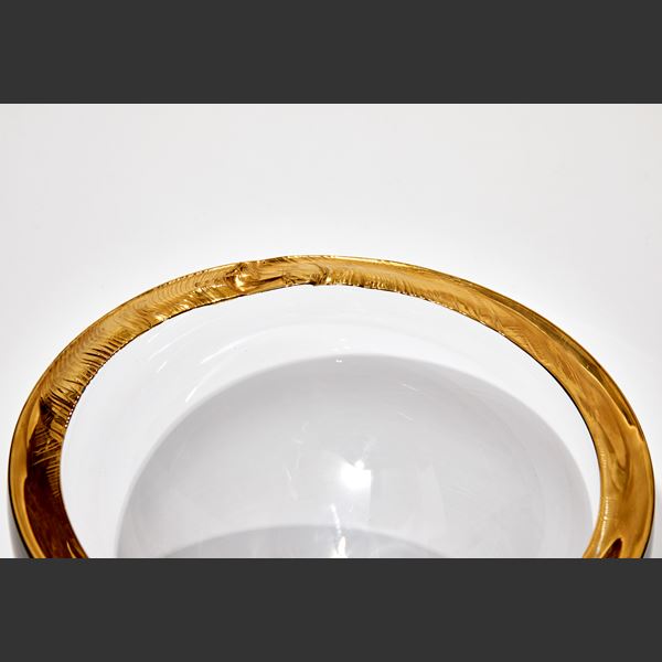 three modern art glass bowls in clear glass with gold or platinum rims