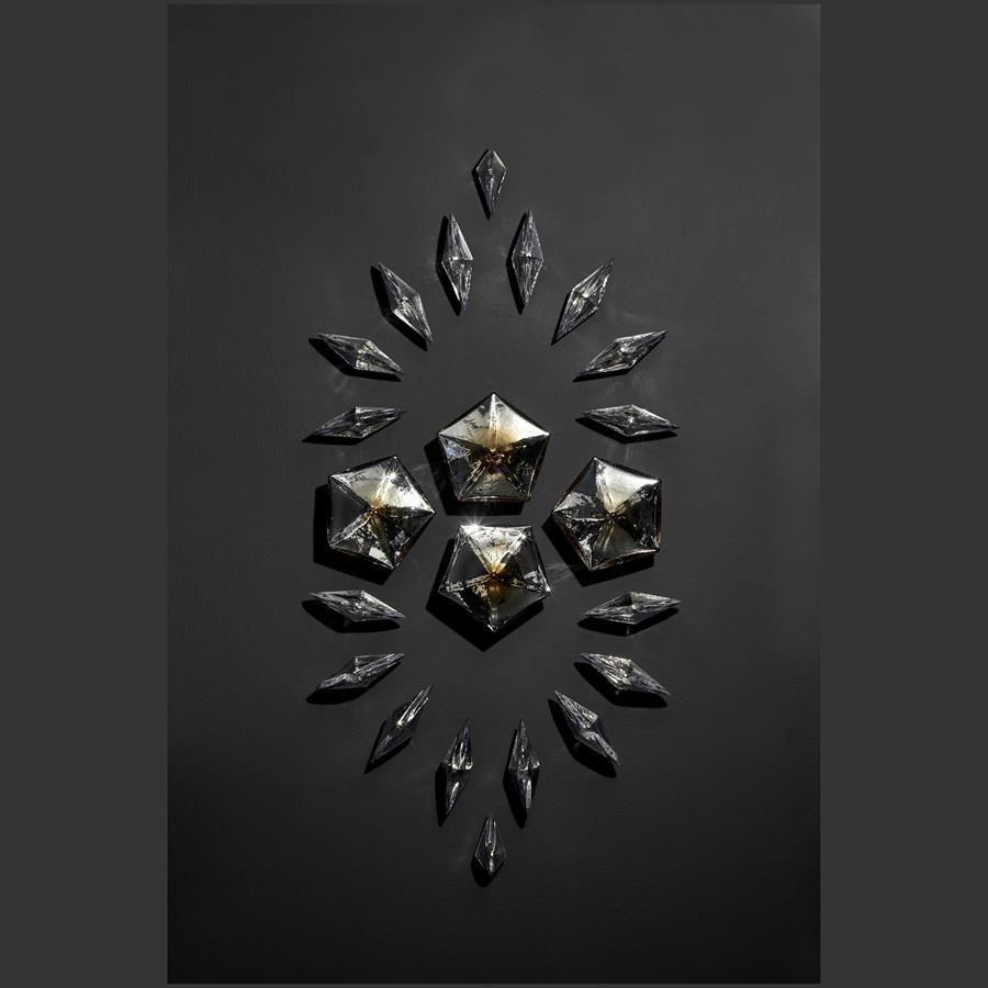 wall mounted bronze glass internally mirrored geometric shaped consisting of  pentagons and diamonds to creating a unique composition